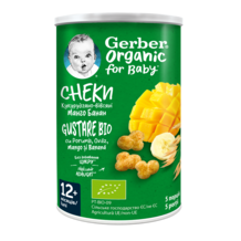 Green Gerber Organic baby snack canister with baby logo, mango and banana graphics and puff snacks.