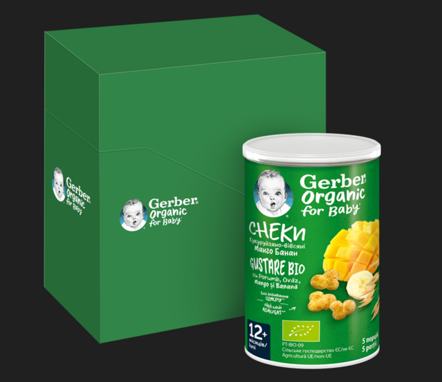 Photo: green Gerber Organic snack can beside matching green box on dark background